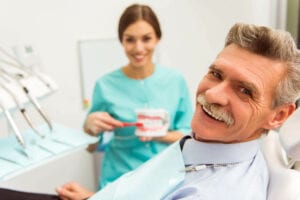 Dentists Interacting With A Male Patient